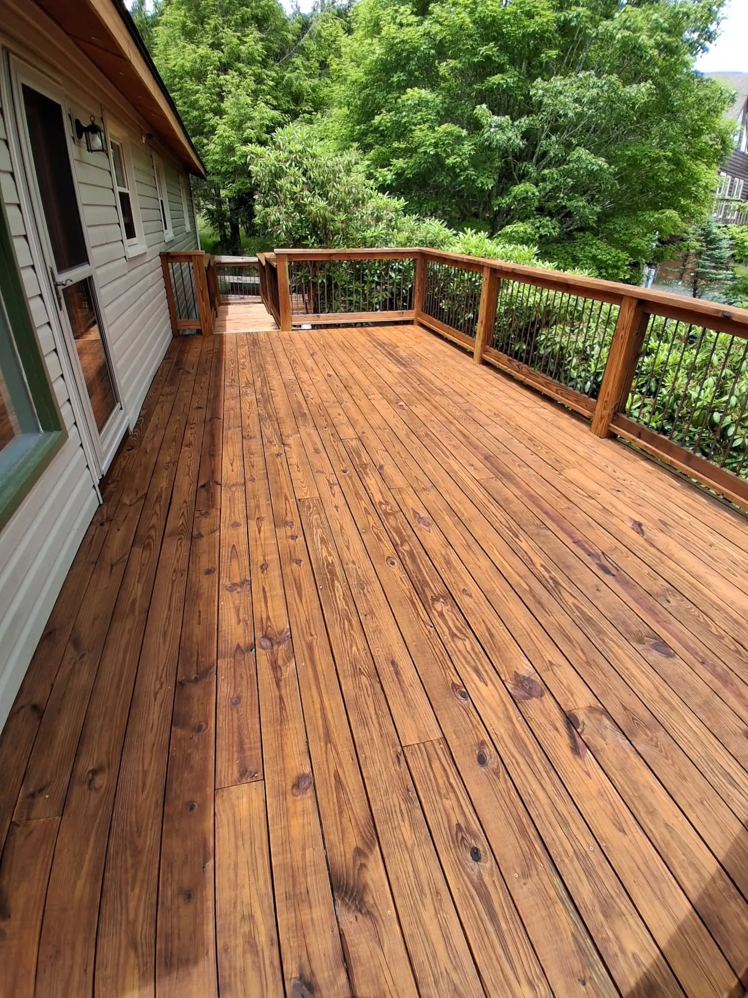Finished stained deck walkway after a deck staining project